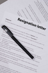 Resignation letter on office desk, formal document where employee voluntarily leaves job, symbol of professional change, career transition, and emotional decision at workplace.