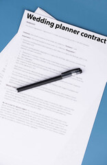 Wedding planner contract on desk, professional legal agreement for event coordination, vendor management and wedding organization, symbol of trust, creativity, and celebration planning success.