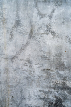 Grungy Grey Concrete Wall Texture with Fine Cracks and Weathered Industrial Finish