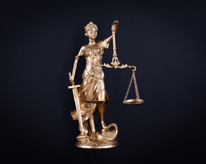 golden Goddess of Justice Themis isolated on black background