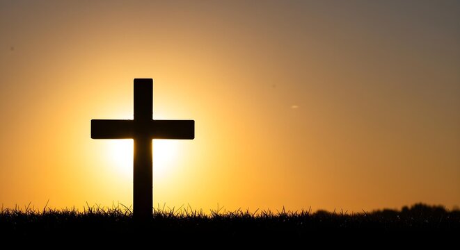 Christian Cross Silhouette with Sunrise Light for Easter