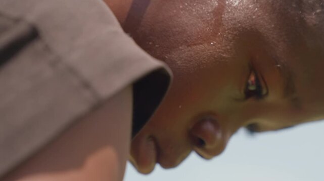 Determined boy develops strategy. Focused youth meticulously devises careful plan. Dedicated and concentrated young person exclusively examines and strategizes with unwavering resolve