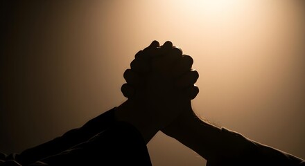 Hands Clasped in Prayer Silhouette for Good Friday Solemn Reflection