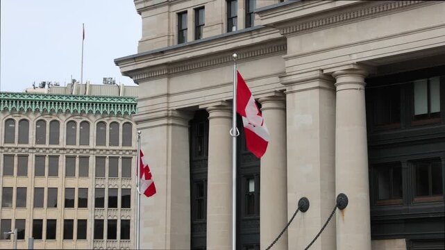 Senate of Canada building with Canadian flags waving