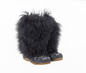 Black long fur boots isolated on white background