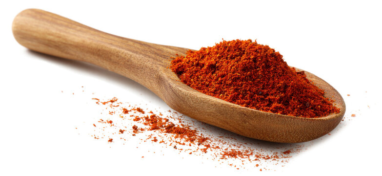 A wooden spoon with red powder on it