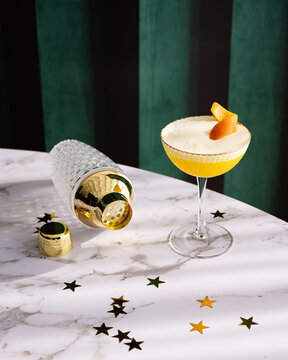 Sparkling orange cocktail on marble table