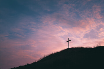 Obraz premium Open Countryside Landscape with Small Cross on Horizon at Warm Sunset. Generative AI