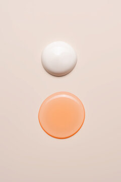 Cosmetic swatches on a simple beige background
