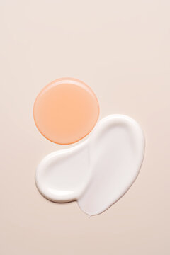 Cosmetic swatches on a beige background