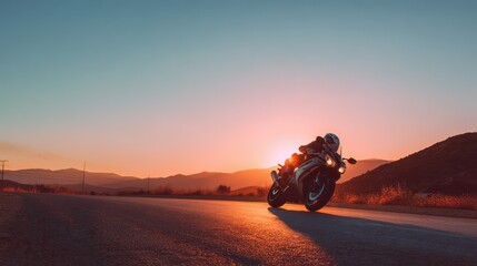 Fototapeta premium Rider on a modern sport motorcycle during dusk, long shadows and generous copy space