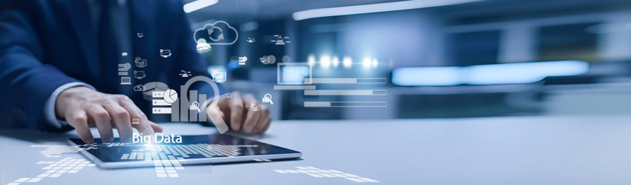 Data analyst holding digital screen. Big Data processes large, complex datasets to uncover patterns, trends, and insights that support strategic business decisions.