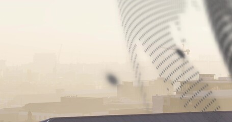 Angling large perforated duct cutting across rooftop, showing hazy low roofs, smudges, copy space