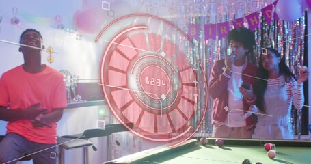 Laughing group of adults wearing coral tee, red jacket, striped top near pool table, hologram, mic