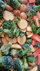 Roasted vegetables with broccoli, potatoes, carrots, and basil before cooking