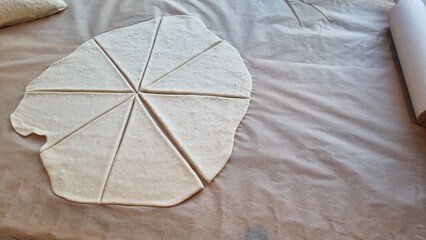 Making dough shapes for baking in a kitchen setting at home