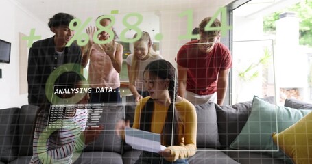 Reading six adults around gray sectional sofa holding paper and viewing data overlay at home