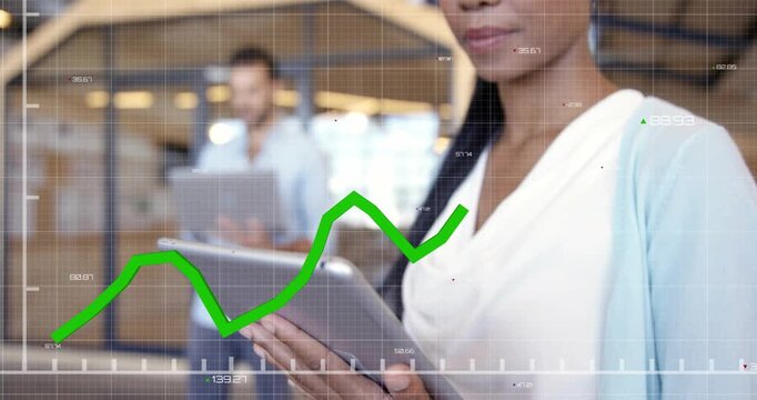 Woman tapping tablet and causing animated green line chart overlay, monitoring business analytics