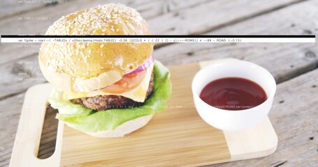 Sesame burger sitting on cutting board on rustic plank table, with ketchup bowl, cheese, code lines © vectorfusionart