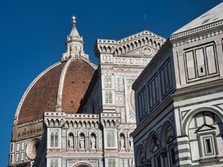 Florence Duomo, Dome, and Baptistery Complex View - Low-angle close-up showcasing the terracotta...