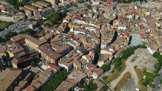 An Aerial panoramic view of the old town of the city  Barbastro on a sunny summer noon in France.