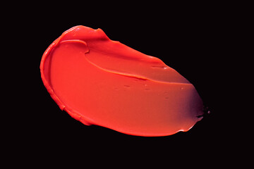 Red satin or matte finish moisture lipstick or lip gloss black isolated background texture smudge