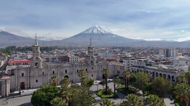 Aerial view of the Plaza de Armas in Arequipa and the Misti volcano with snow during the rainy season