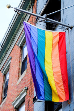 New York City, New York. USA. Rainbow flag hanging from building in New York City.