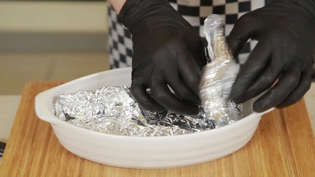 Professional chef preparing baked celery root while making puree