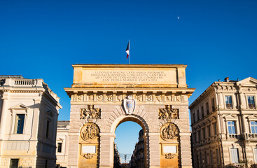 Obraz premium Porte du Peyrou, also known as the Arc de Triomphe of Montpellier in France. And the French flag flying.