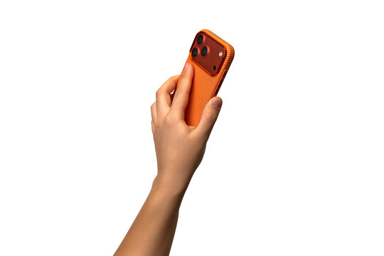 The hand holds a modern orange smartphone with three cameras, back view. The hand holds a mobile phone with three cameras, transparent background, PNG