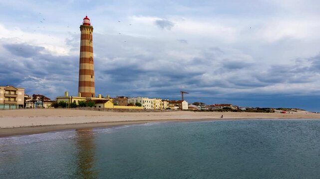 Dramatic Hyperlapse of Praia da Barra Lighthouse Under Stormy Clouds, Aveiro, Portugal