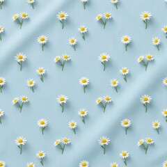 Spring pattern of tiny daisies on soft blue background. Simple and cheerful botanical motif with clean commercial look. Uniform spacing and diffused lighting.