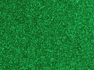 Fototapeta premium Macro photography of bright green metallic paint texture with sparkling flakes