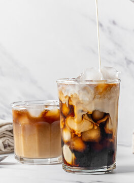 Iced coffee with oat milk creamer swirl