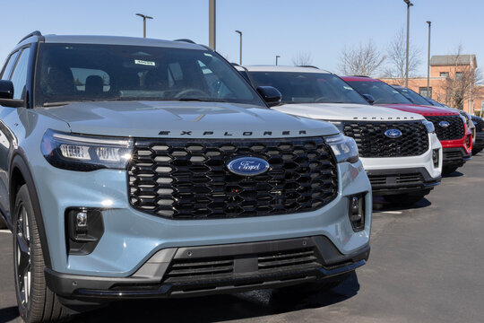 Ford Explorer SUV display at a dealership. Ford offers the Explorer in Active, ST-Line, Tremor, Platinum, and ST models.