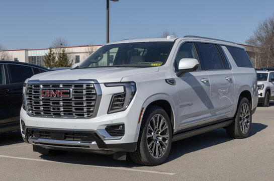 GMC Yukon XL 4WD Denali large SUV display at a dealership. GMC offers the Yukon with a 6.2L Ecotec3 V8 engine. MY:2026