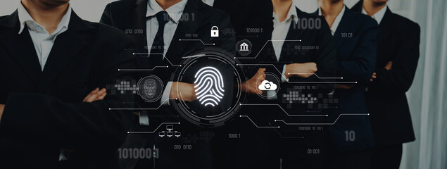 A group of business professionals stands together in suits with a digital fingerprint overlay symbolizing security and identity verification in modern technology. Trope © InfiniteFlow