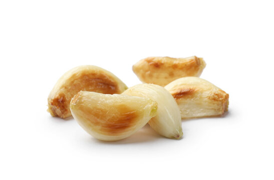 Fresh grilled garlic cloves isolated on white