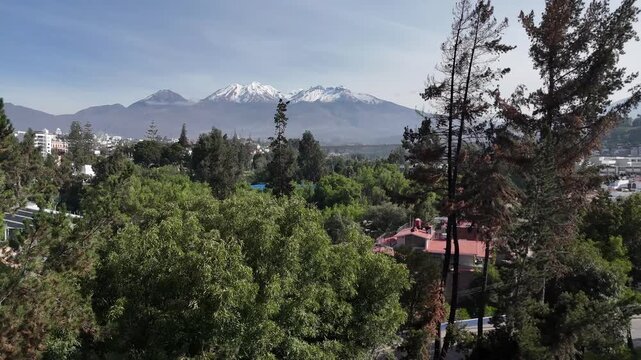 View of the Chachani volcano from the Grau bridge during the rainy season in Arequipa, Peru

