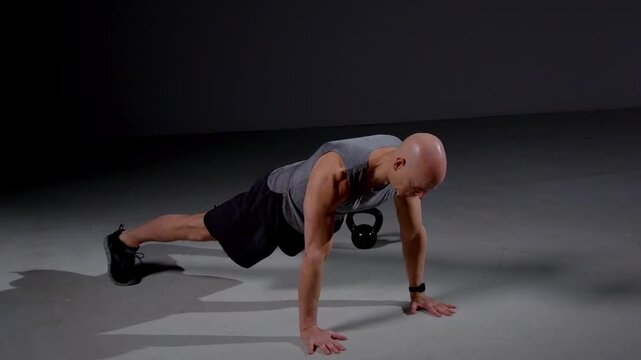 Middle Age Man Push Ups In Studio