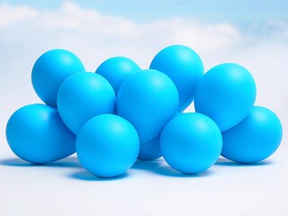 A group of bright sky-blue matte balloons stacked together against a light blue cloudy background.