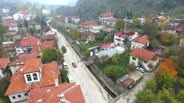 Aerial view of Anatolian old town houses and cityscape life in a small city in Turkey. Traditional Central Anatolia homes line narrow streets as daily life unfolds across the urban landscape.