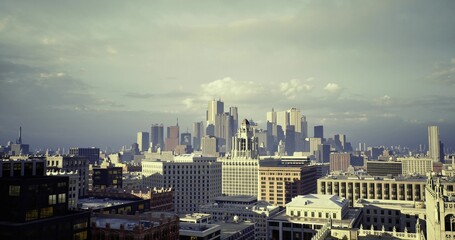 Fototapeta premium city skyline under dramatic storm clouds with darkened towers and textured sky, atmospheric tension, high contrast lighting, ideal for weather, energy,