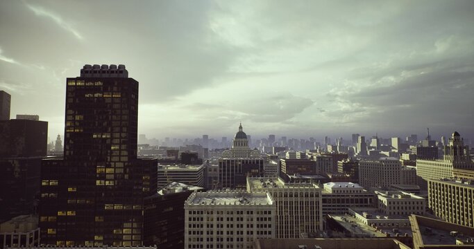 afterstorm sunrise illuminating capitol rooftops and wet streets, hopeful light breaking through cloudbreak, reflections in puddles around historic dome,