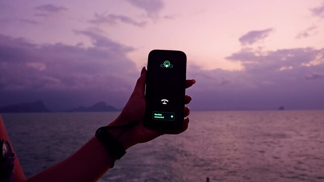 Smartphone Held Against Open Sea at Twilight Displaying Starlink Satellite Internet Connection During Calm Maritime Crossing