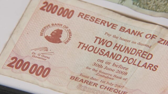 Close up of paper printed money in twenty billion, 200 thousand, and one dollar bill of Zimbabwe reserve bank inflated and inflation economy valueless moneys and poverty from 2020s in foreign value