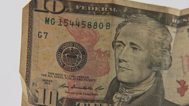 United States of American Federal Reserve System logo stamp on printed America paper money currency of national government business and economics economy in slow motion close up tight shot and detail