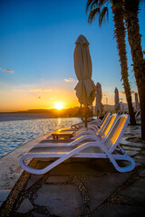 Sun loungers are located by the pool in the hotel
