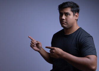 Professional man in studio with minimal background